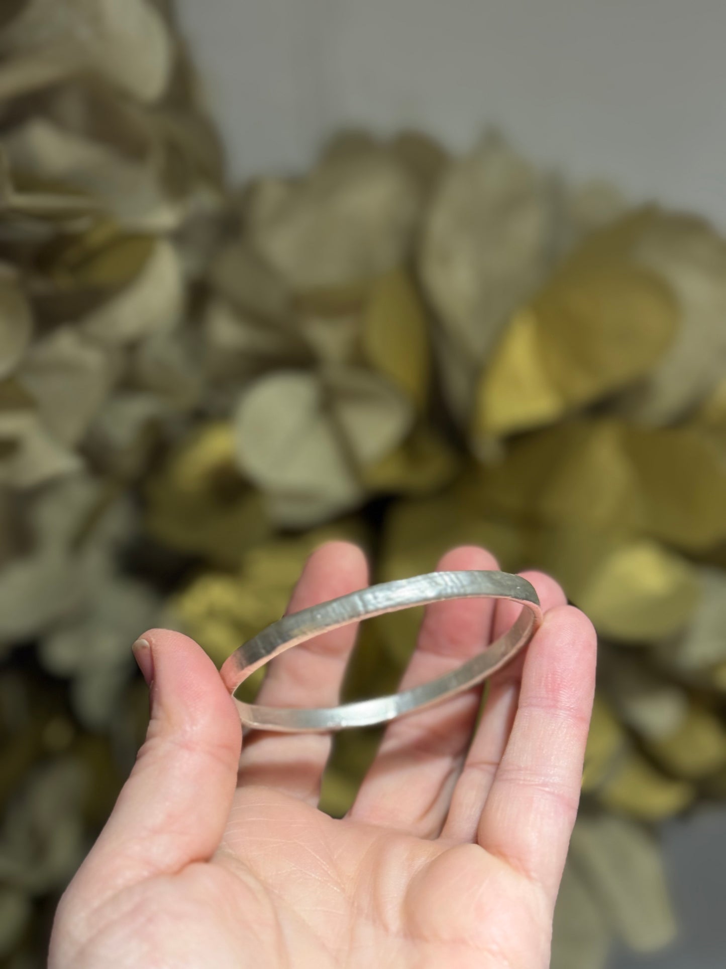 Organic textured silver bangle.