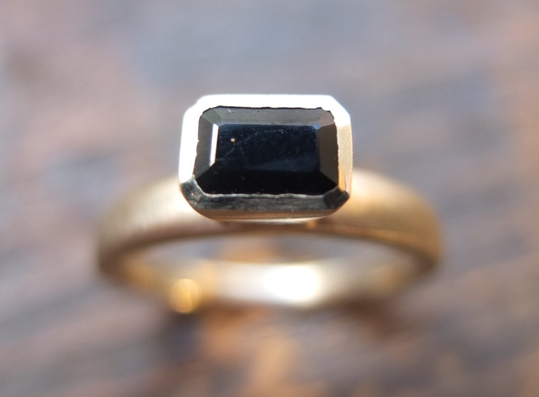 Black sapphire white gold ring.