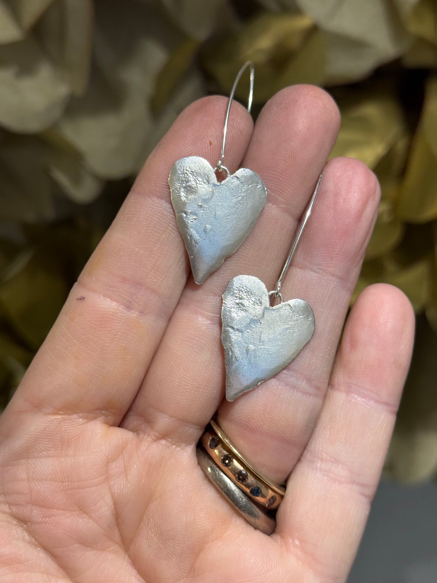 Large leafy heart silver earrings.
