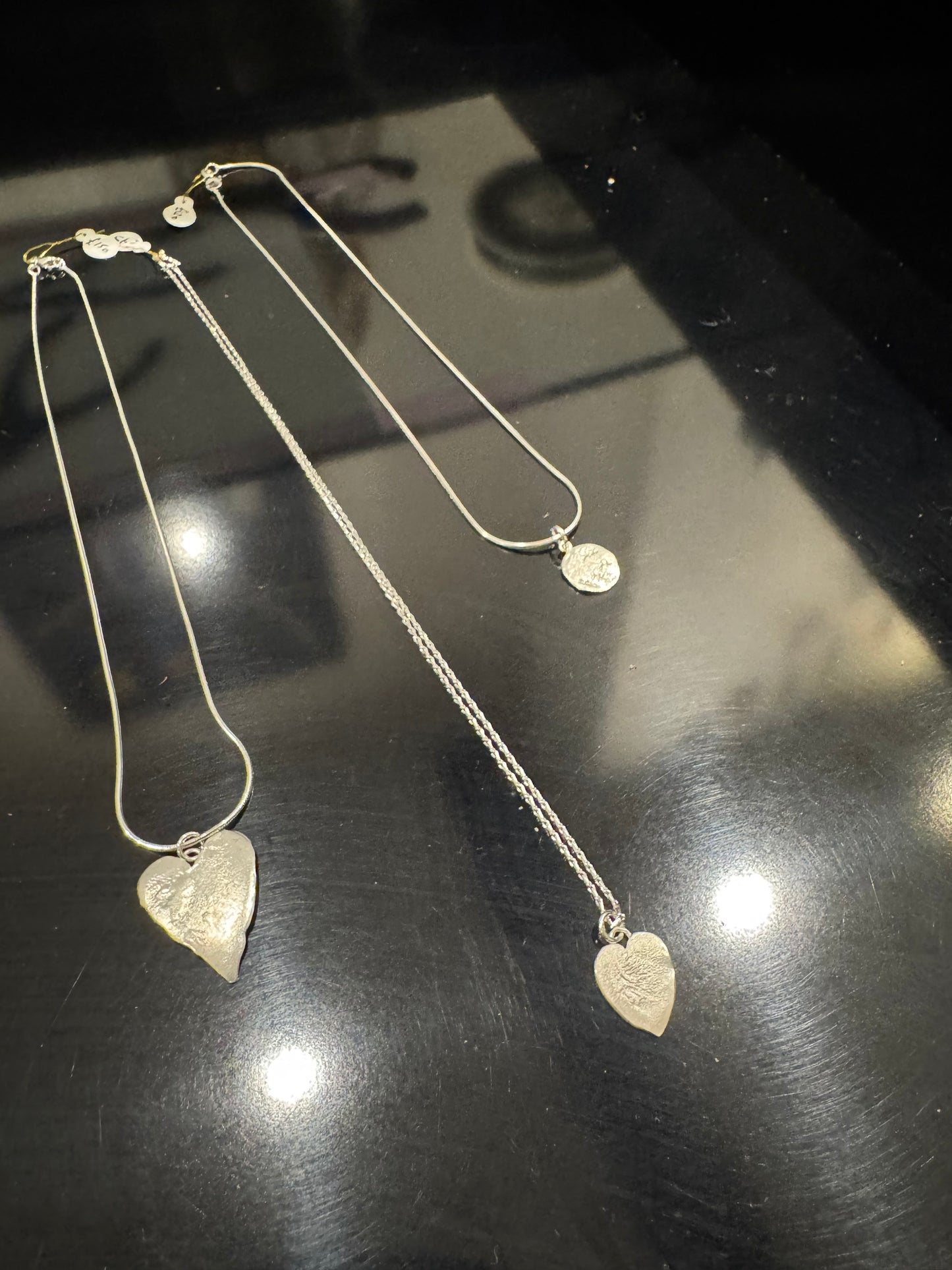 Large leafy heart silver earrings.