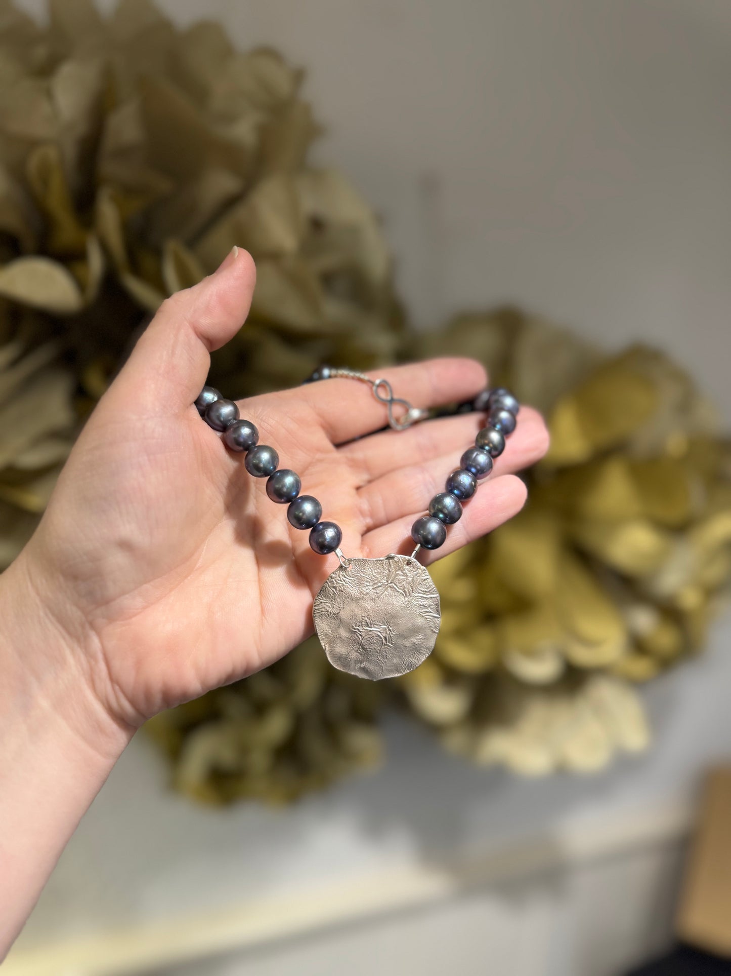 Black pearl silver pendant necklace.