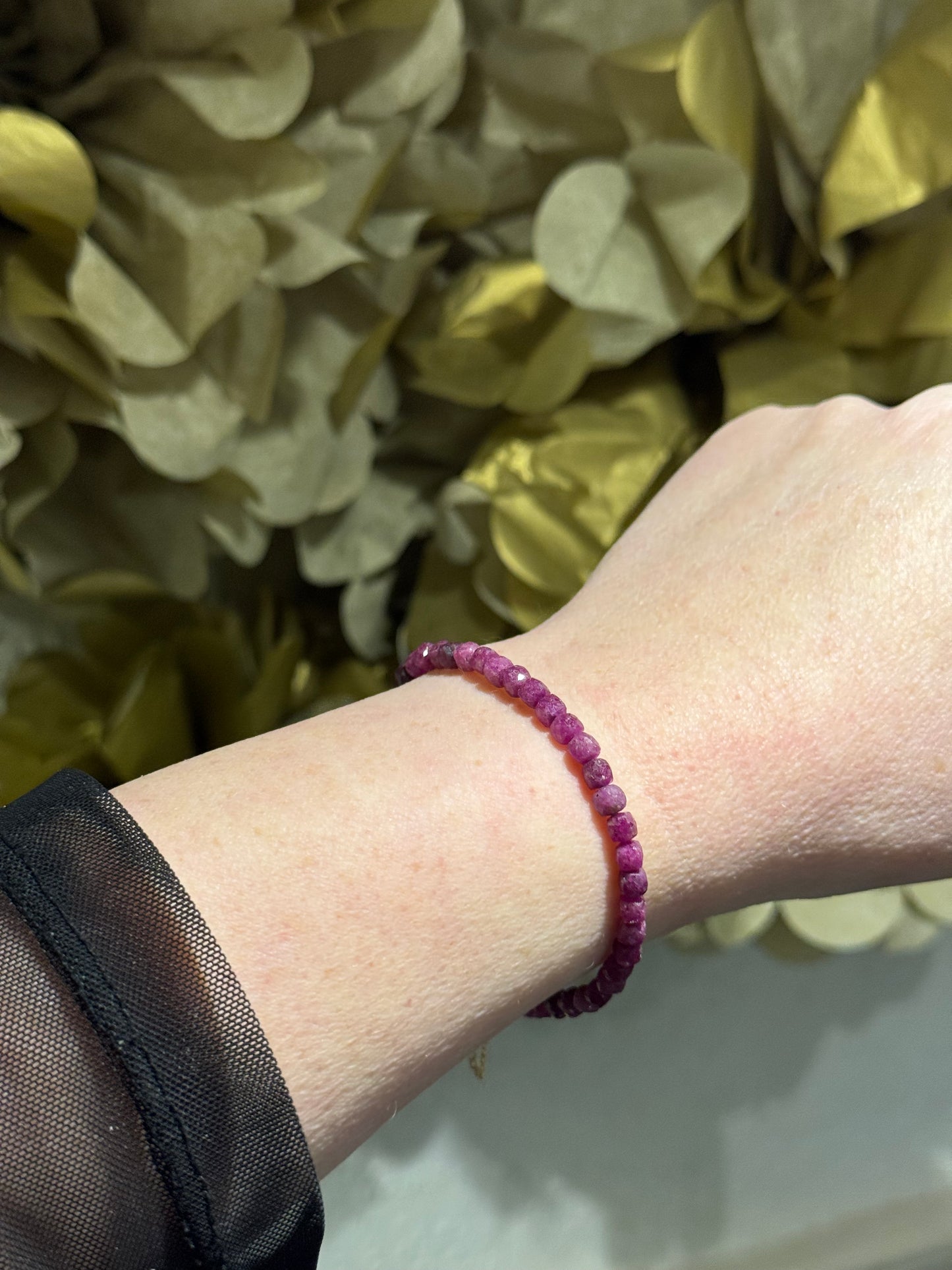 Ruby gemstone sparkly filled-gold magnetic bracelet.