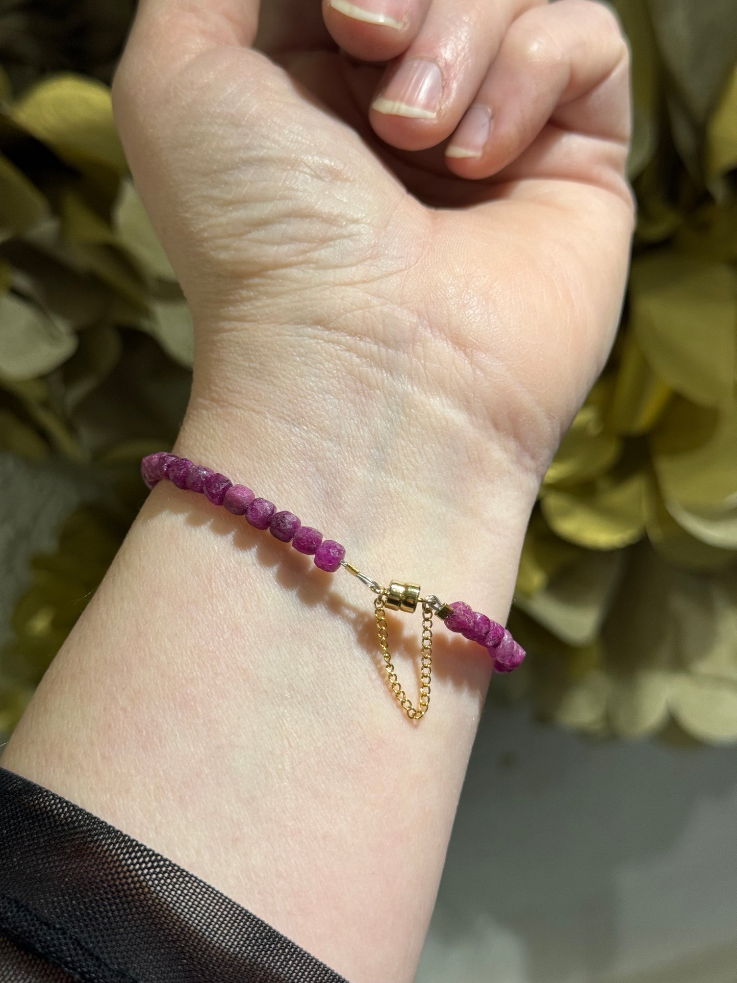 Ruby gemstone sparkly filled-gold magnetic bracelet.