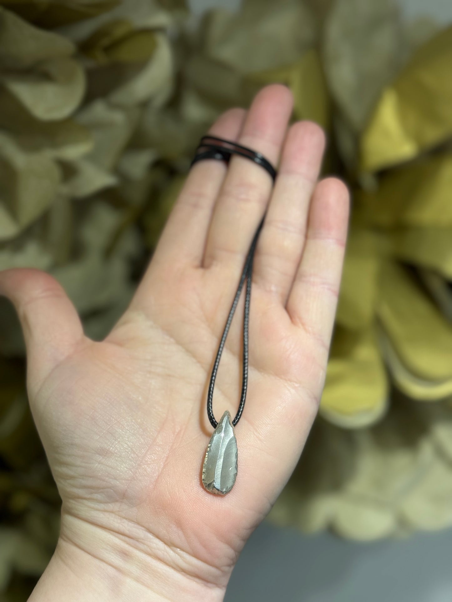 Ancient flint cast silver pendant
