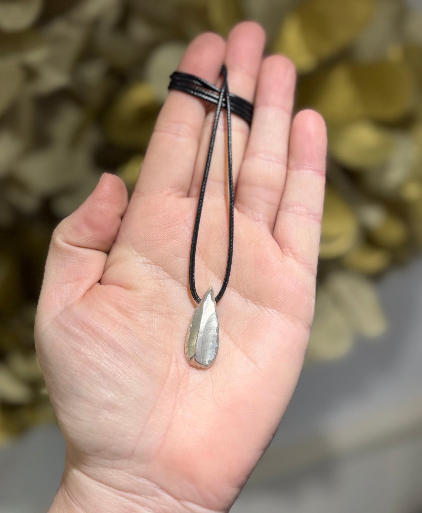 Ancient flint cast silver pendant