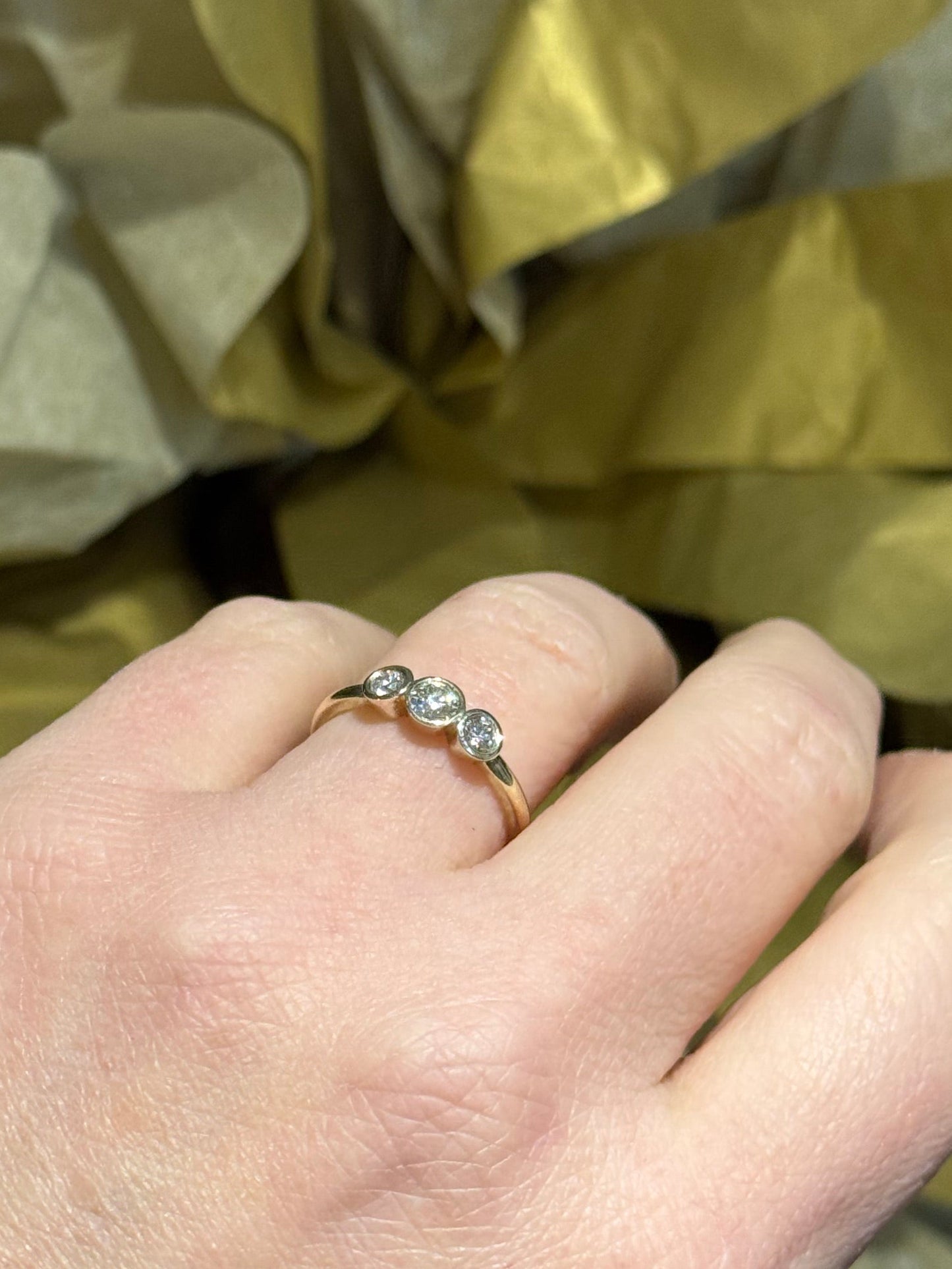 Trilogy white gold diamond ring.