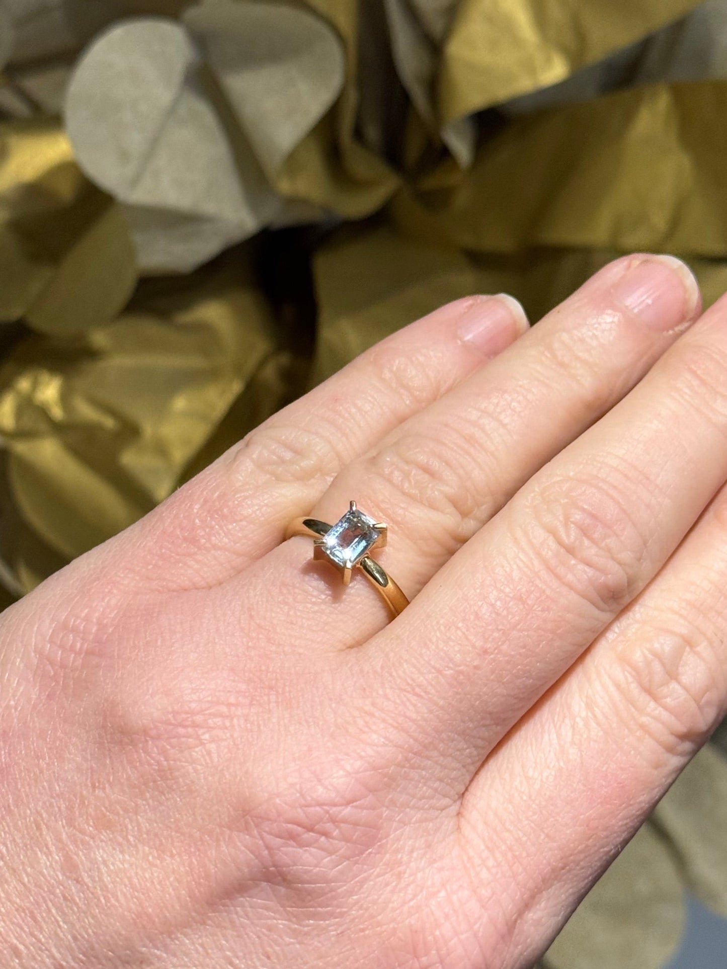 Aquamarine Claw yellow gold ring.