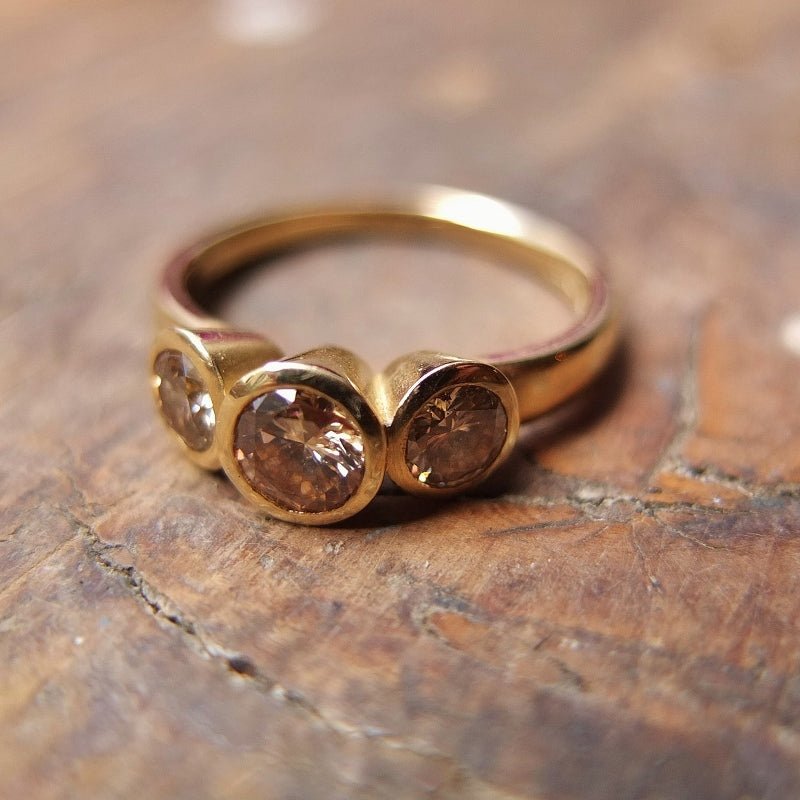 Champagne diamond trilogy 9ct yellow gold ring.