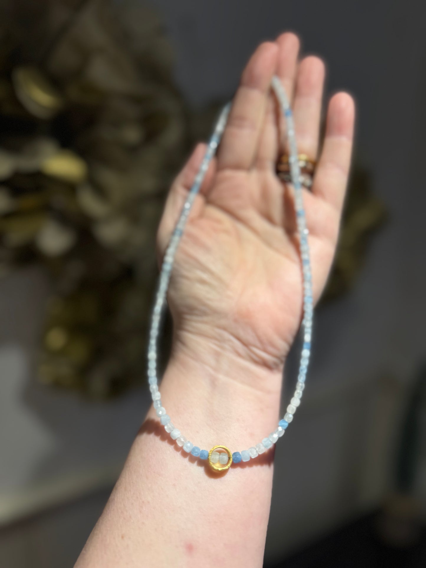 Aquamarine faceted cube silver-gilt ring necklace.