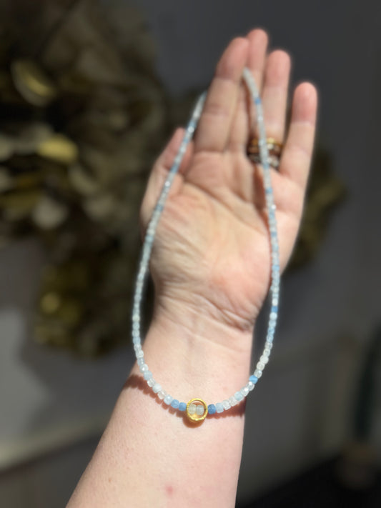 Aquamarine faceted cube silver-gilt ring necklace.