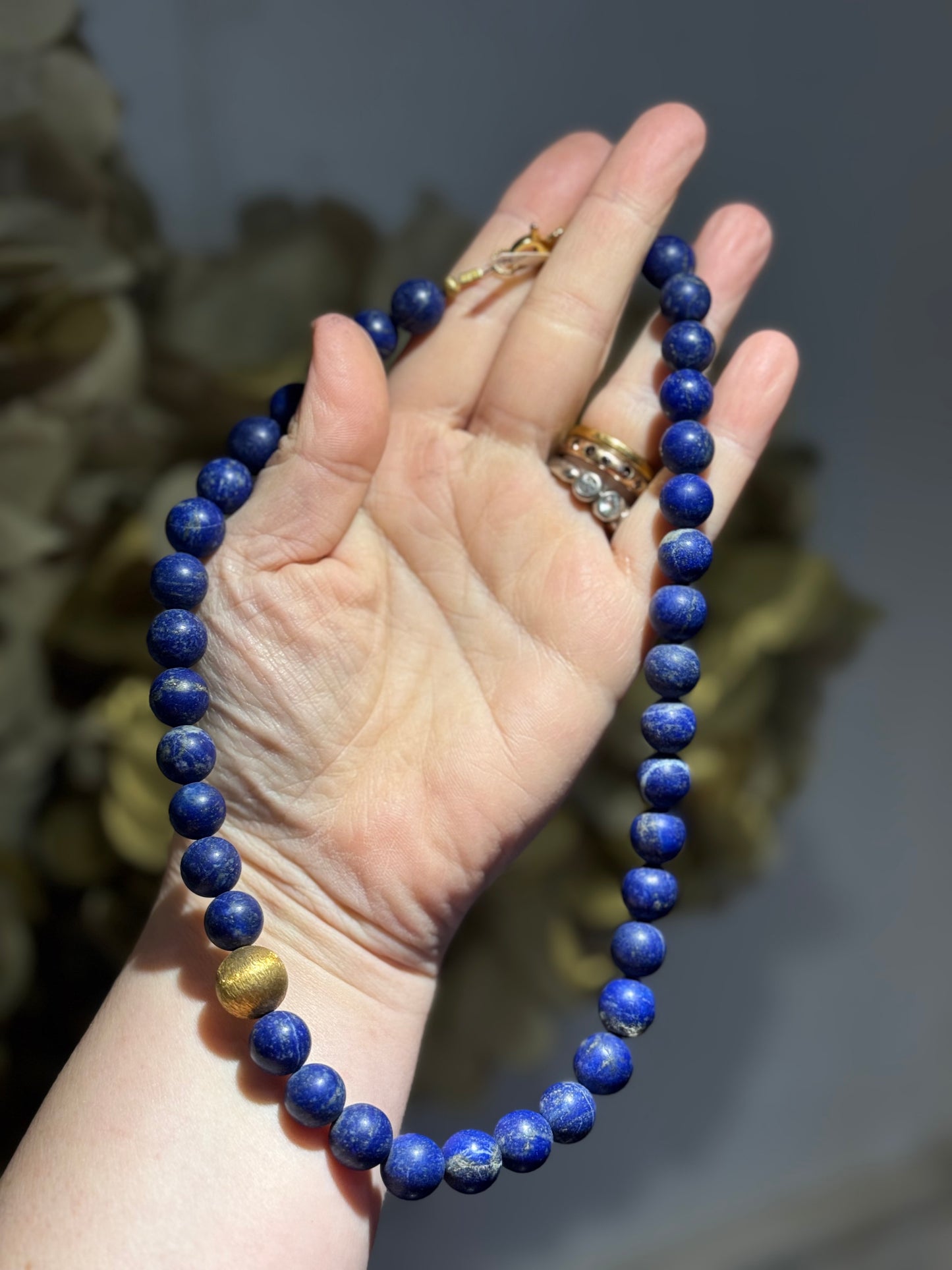 Lapis Lazuli silver-gilt round bead necklace.