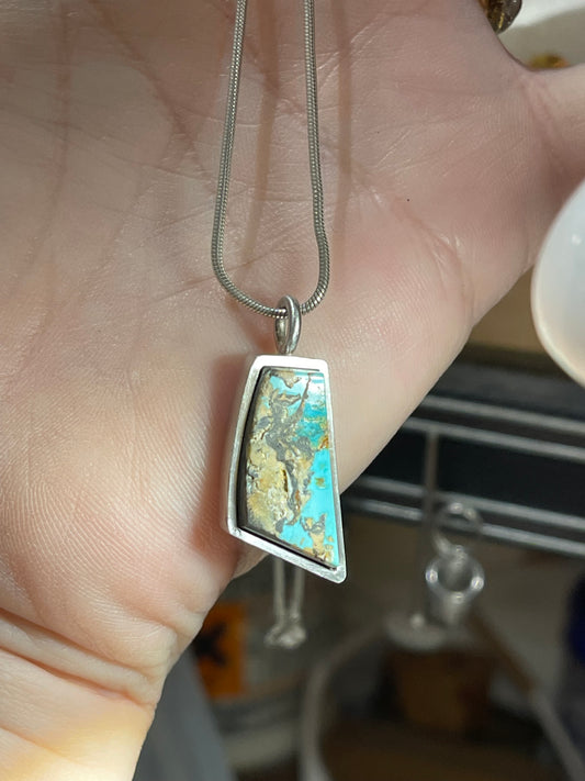 African free form sterling silver pendant.